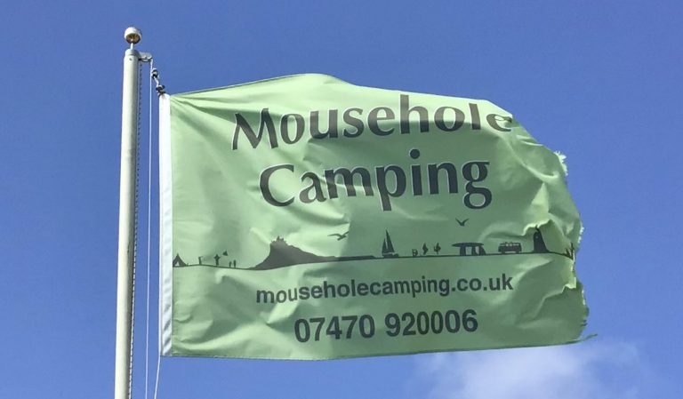 Mousehole Camping Flag flying at the campsite