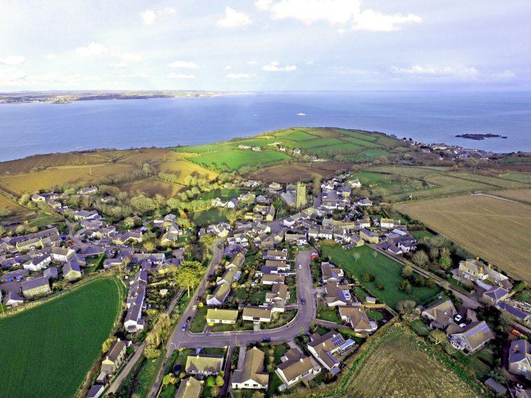 Aerial view of Paul village, looking out across Mounts Bay towards St Michael's Mount