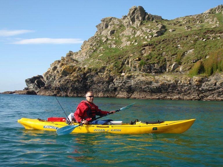 Man in sea Kayak on West Cornish Coast